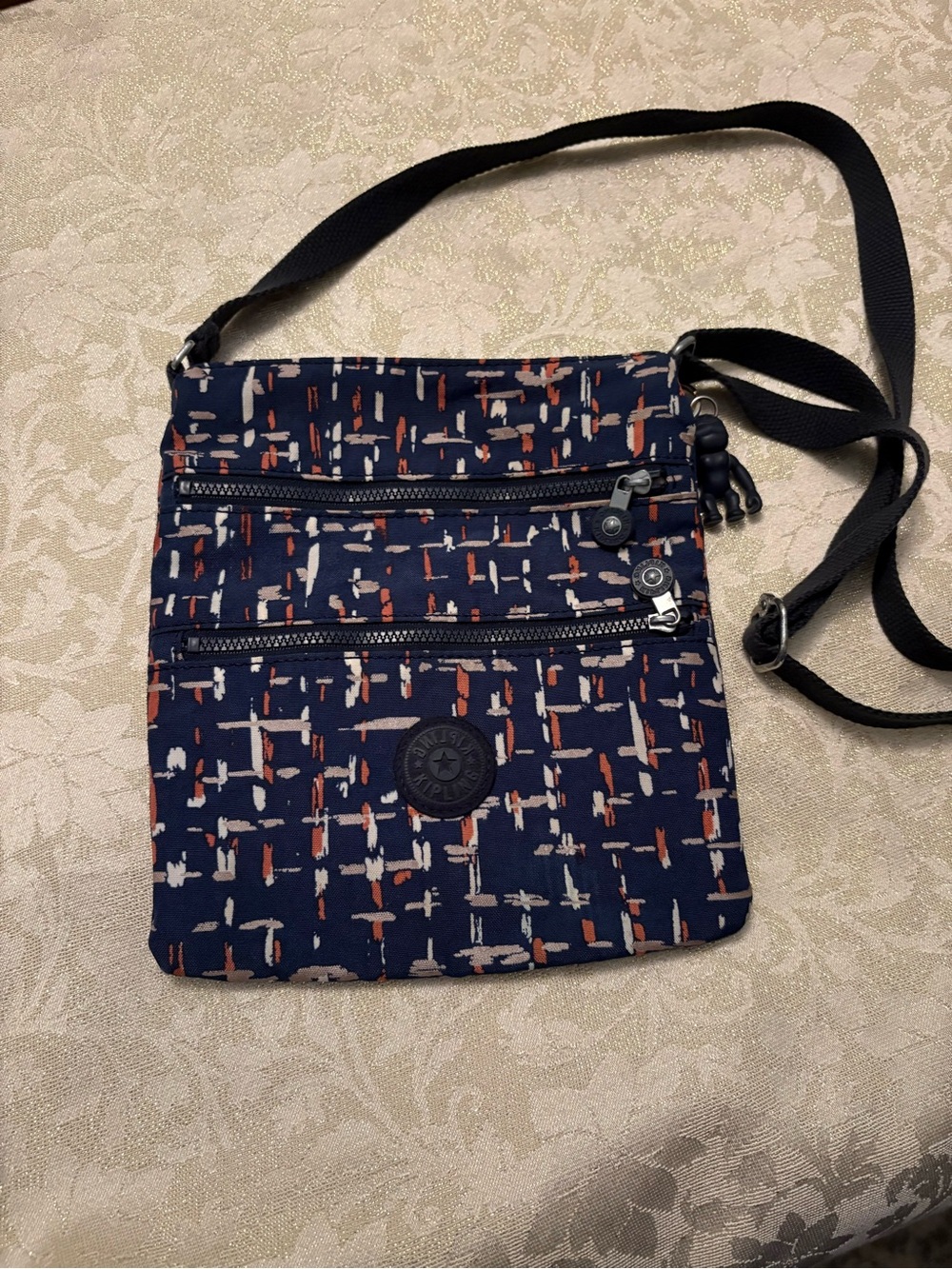Kipling Keiko Navy Crossbody Bag with White and Rust Abstract City Lights Print